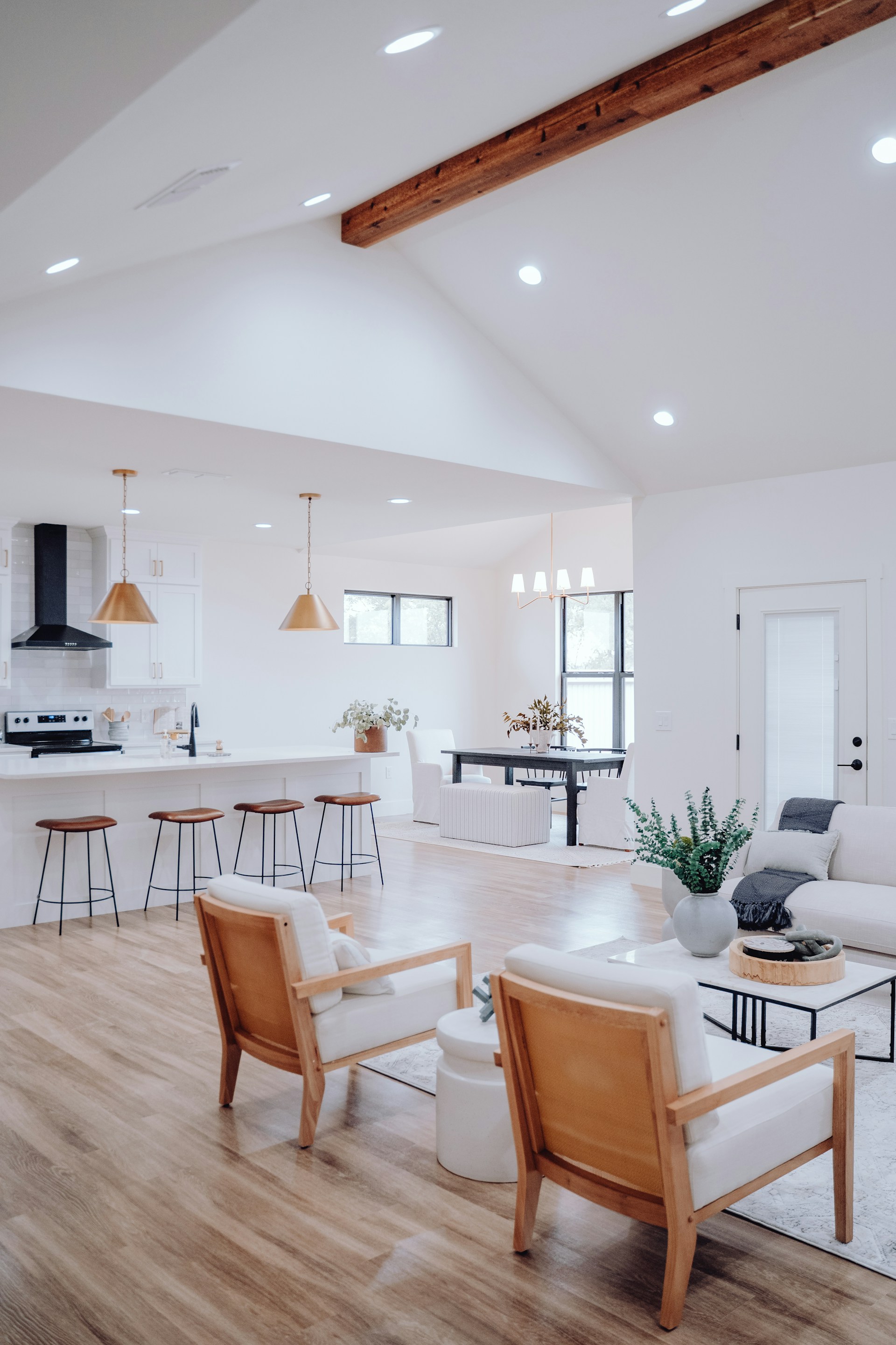 Open modular kitchen seamlessly connected to the dining and living room in a modern apartment