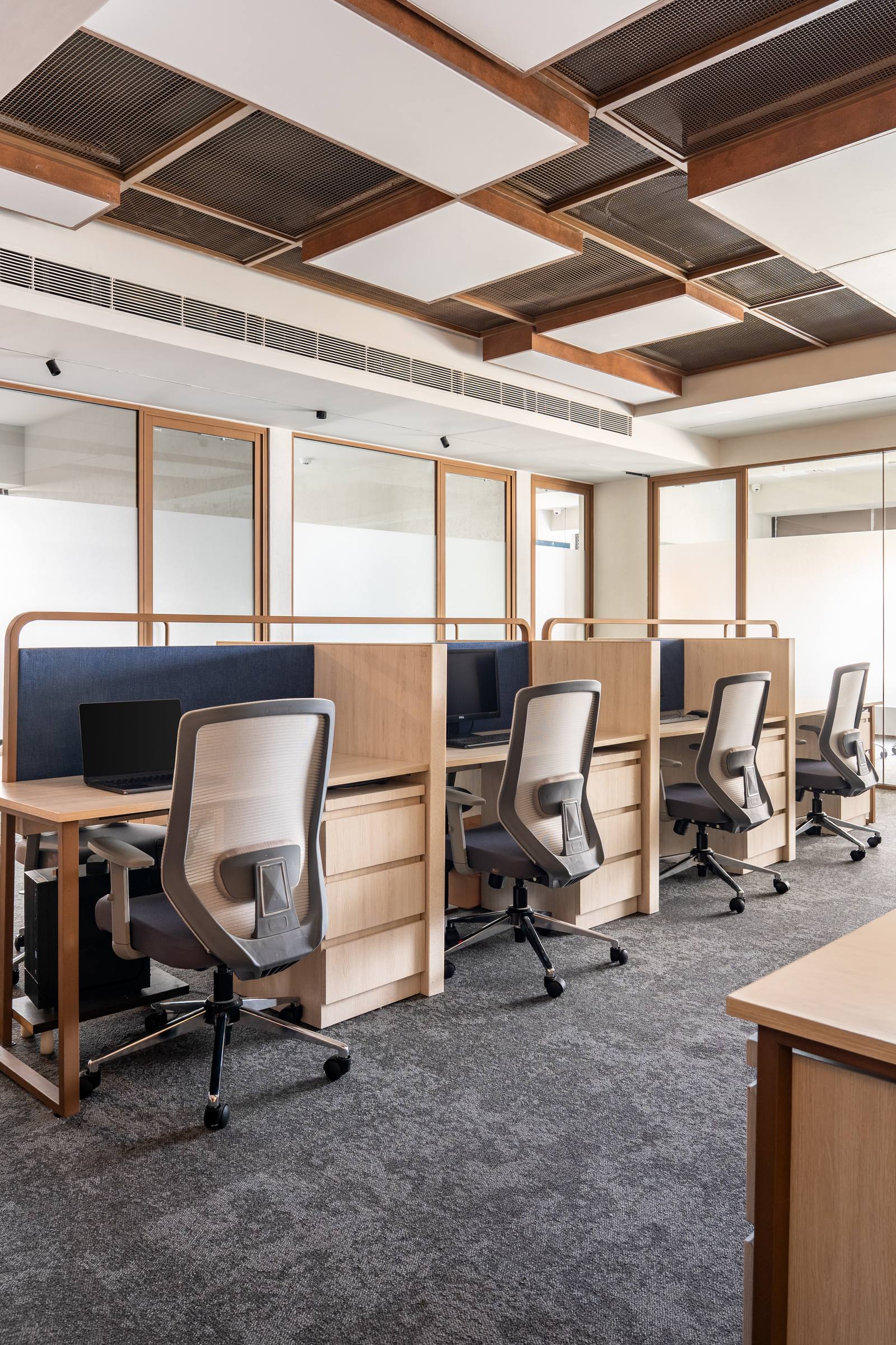Open-plan commercial workspace with collaborative desking by Beyond Briks