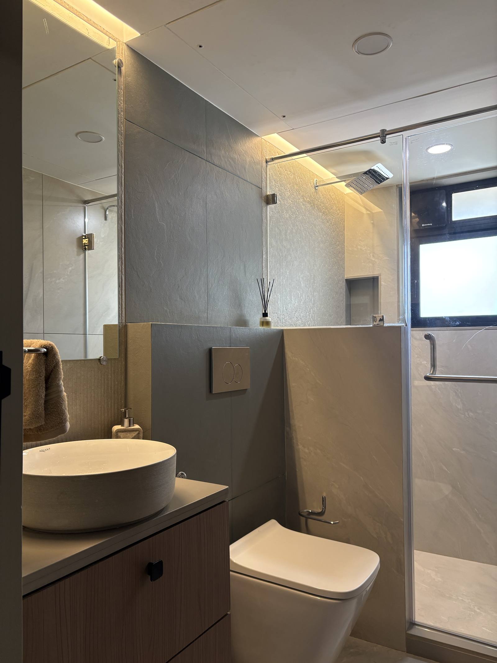 Spa-style bathroom with vessel sink and rain shower by Beyond Briks