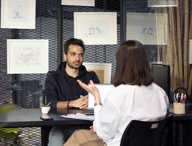 Interior designer consulting with client on turnkey project requirements