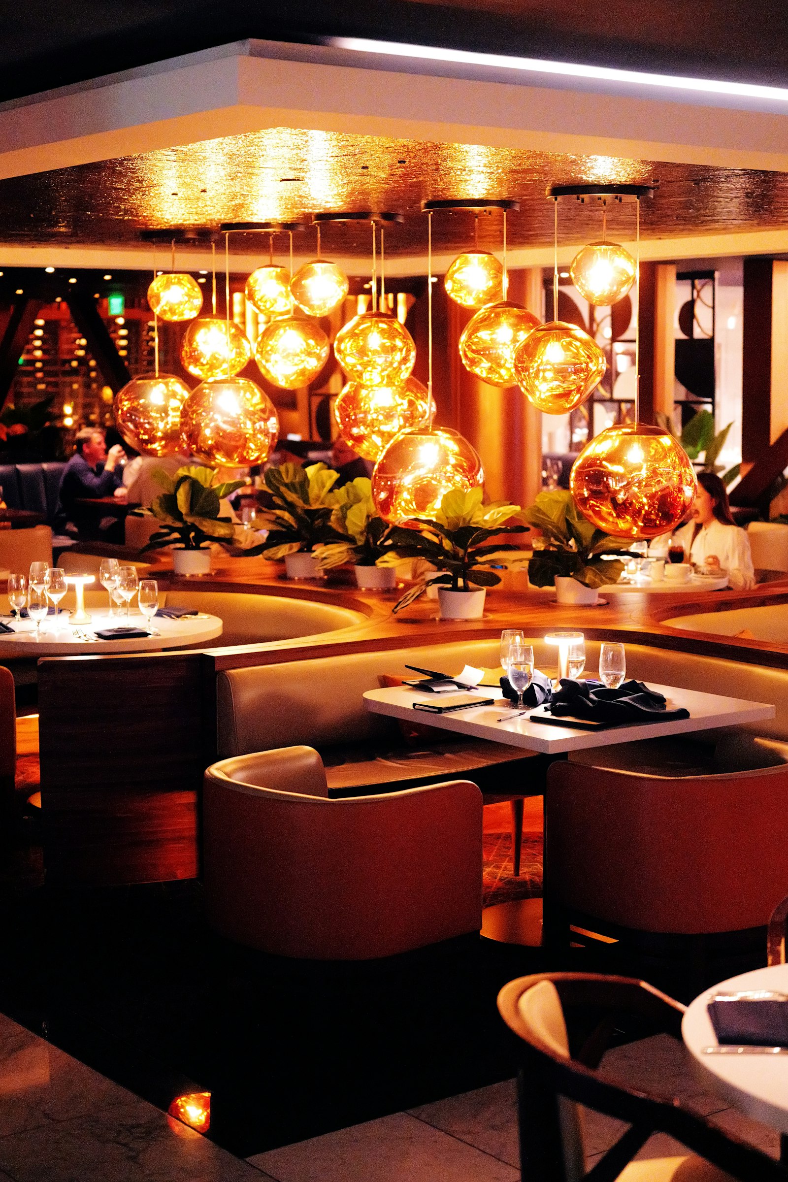 Luxury restaurant interior with ambient lighting by Beyond Briks