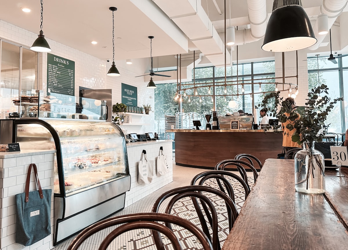 Premium cafe makeover interior design with modern lighting and designer furniture